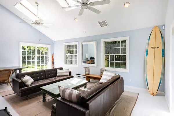 a living room with furniture and a window