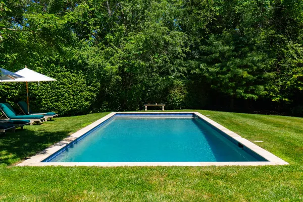 a view of swimming pool from a yard
