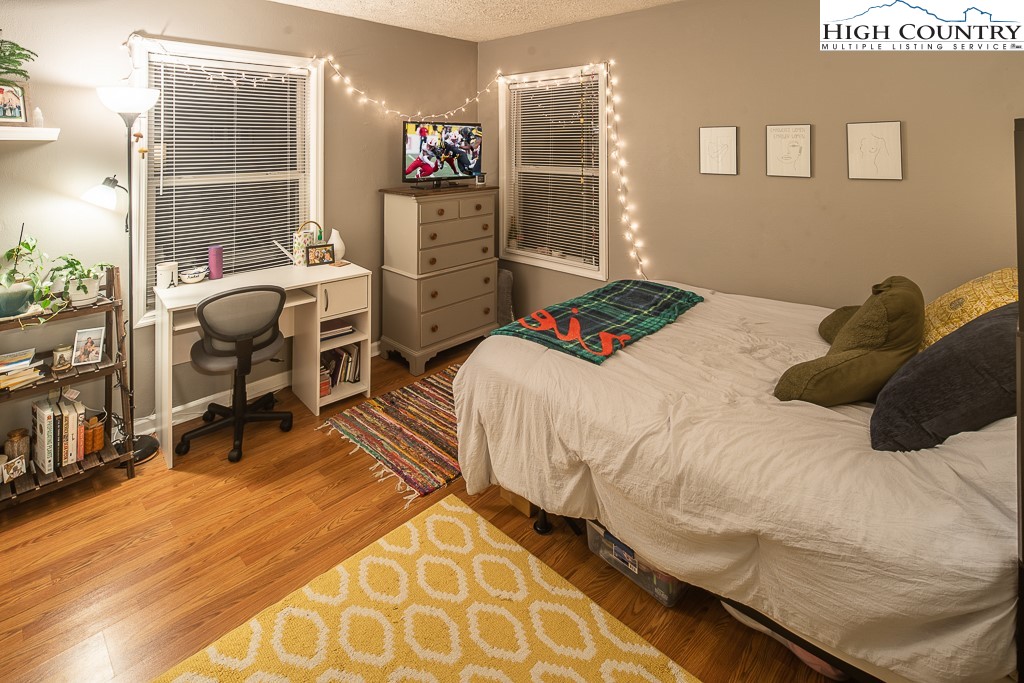800 Meadowview Drive, Unit 6 Boone, NC 28607 - Photo 14 of 19 a bedroom with a bed and a window