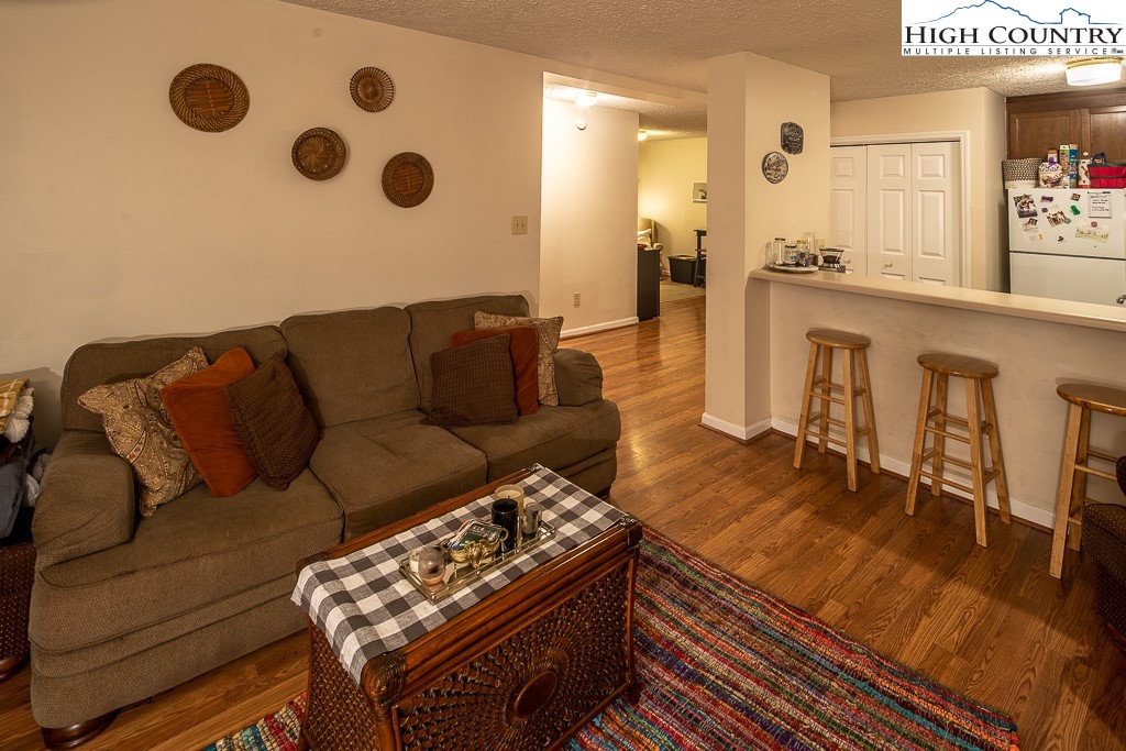 800 Meadowview Drive, Unit 6 Boone, NC 28607 - Photo 4 of 19 a living room with furniture and a wooden floor