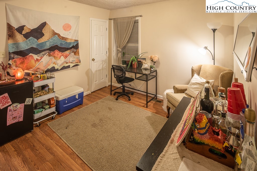 800 Meadowview Drive, Unit 6 Boone, NC 28607 - Photo 7 of 19 a living room with furniture and a wooden floor
