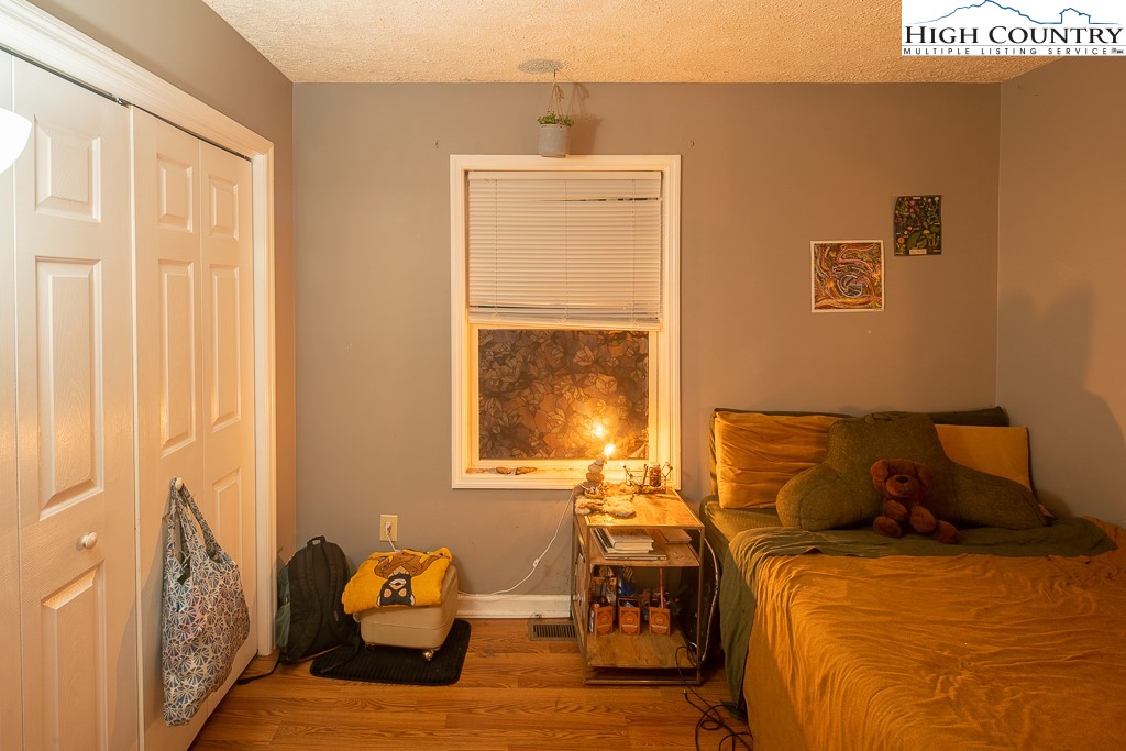 800 Meadowview Drive, Unit 6 Boone, NC 28607 - Photo 10 of 19 a bedroom with a bed and window