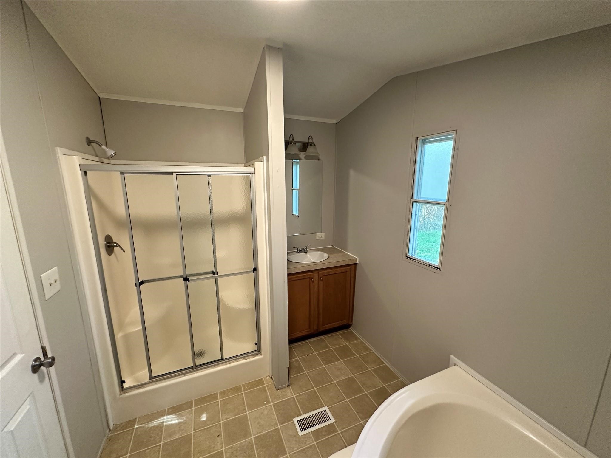 30841 Clyde Lane Hockley, TX 77447 - Photo 14 of 26 a bathroom with a tub and shower