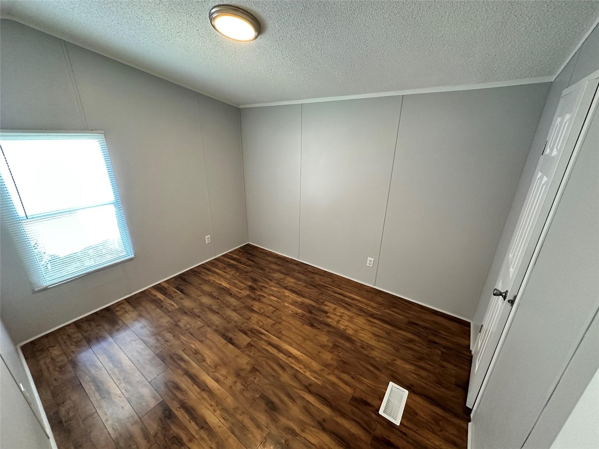 30841 Clyde Lane Hockley, TX 77447 - Photo 17 of 26 a view of empty room with wooden floor and fan