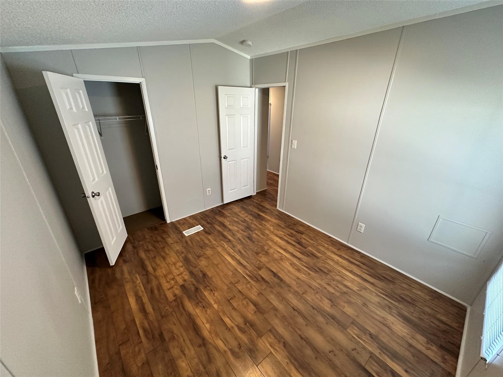 30841 Clyde Lane Hockley, TX 77447 - Photo 18 of 26 an empty room with wooden floor and closet