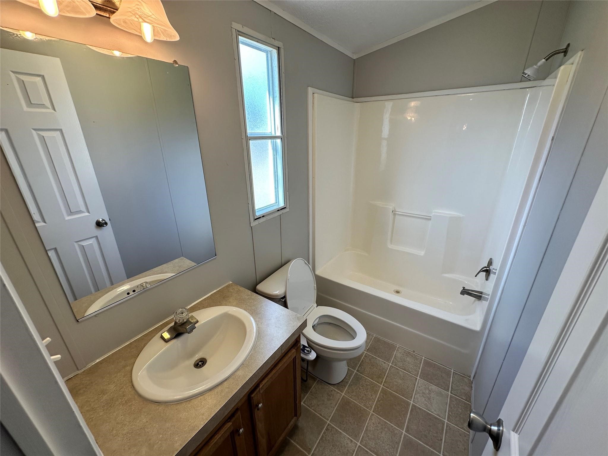 30841 Clyde Lane Hockley, TX 77447 - Photo 19 of 26 a bathroom with a sink a toilet and shower