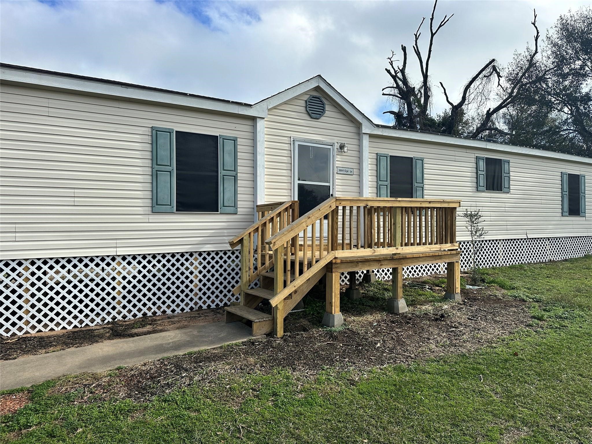 30841 Clyde Lane Hockley, TX 77447 - Photo 2 of 26 a view of a house with a yard and deck