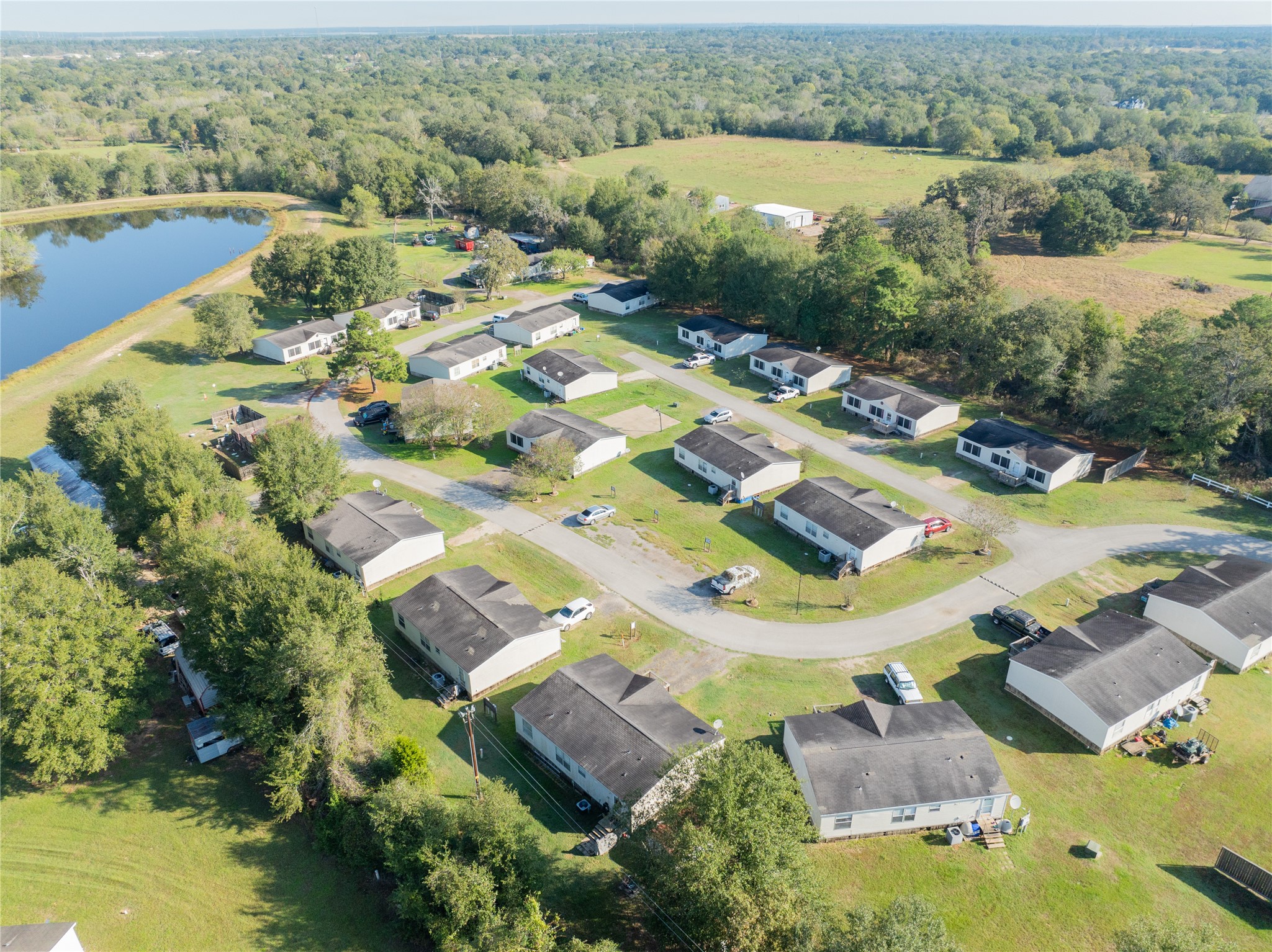 30841 Clyde Lane Hockley, TX 77447 - Photo 24 of 26 an aerial view of residential houses with outdoor space and river