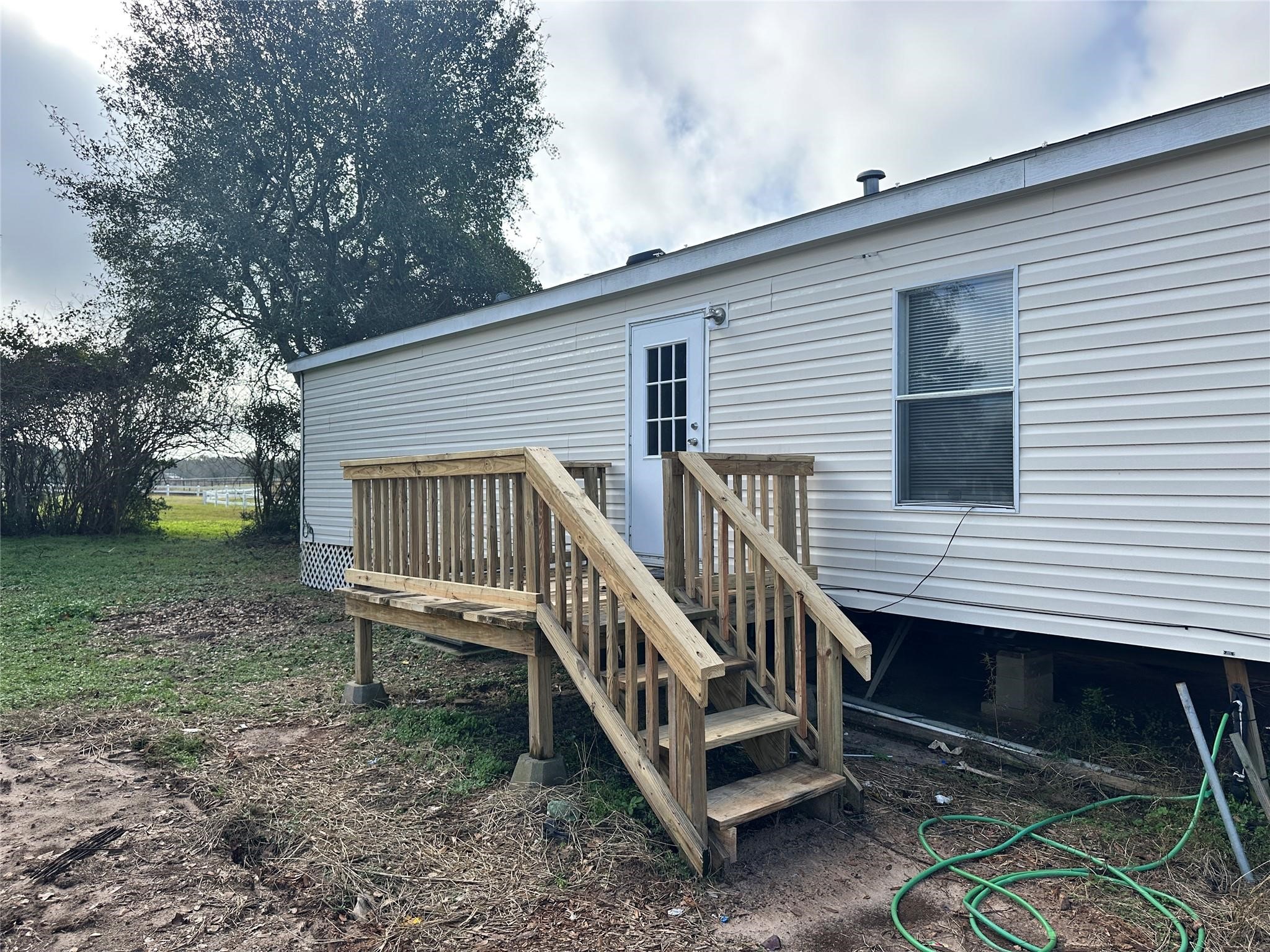 30841 Clyde Lane Hockley, TX 77447 - Photo 3 of 26 a view of a house with a yard and wooden deck