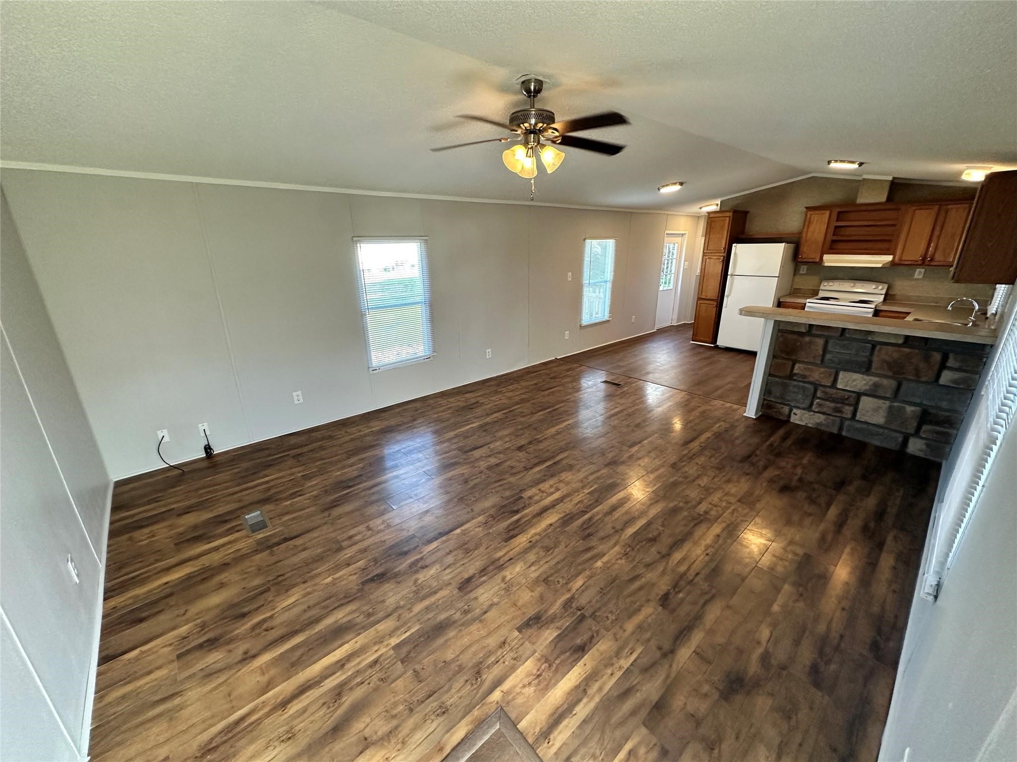30841 Clyde Lane Hockley, TX 77447 - Photo 4 of 26 a view of a room with wooden floor and ceiling fan