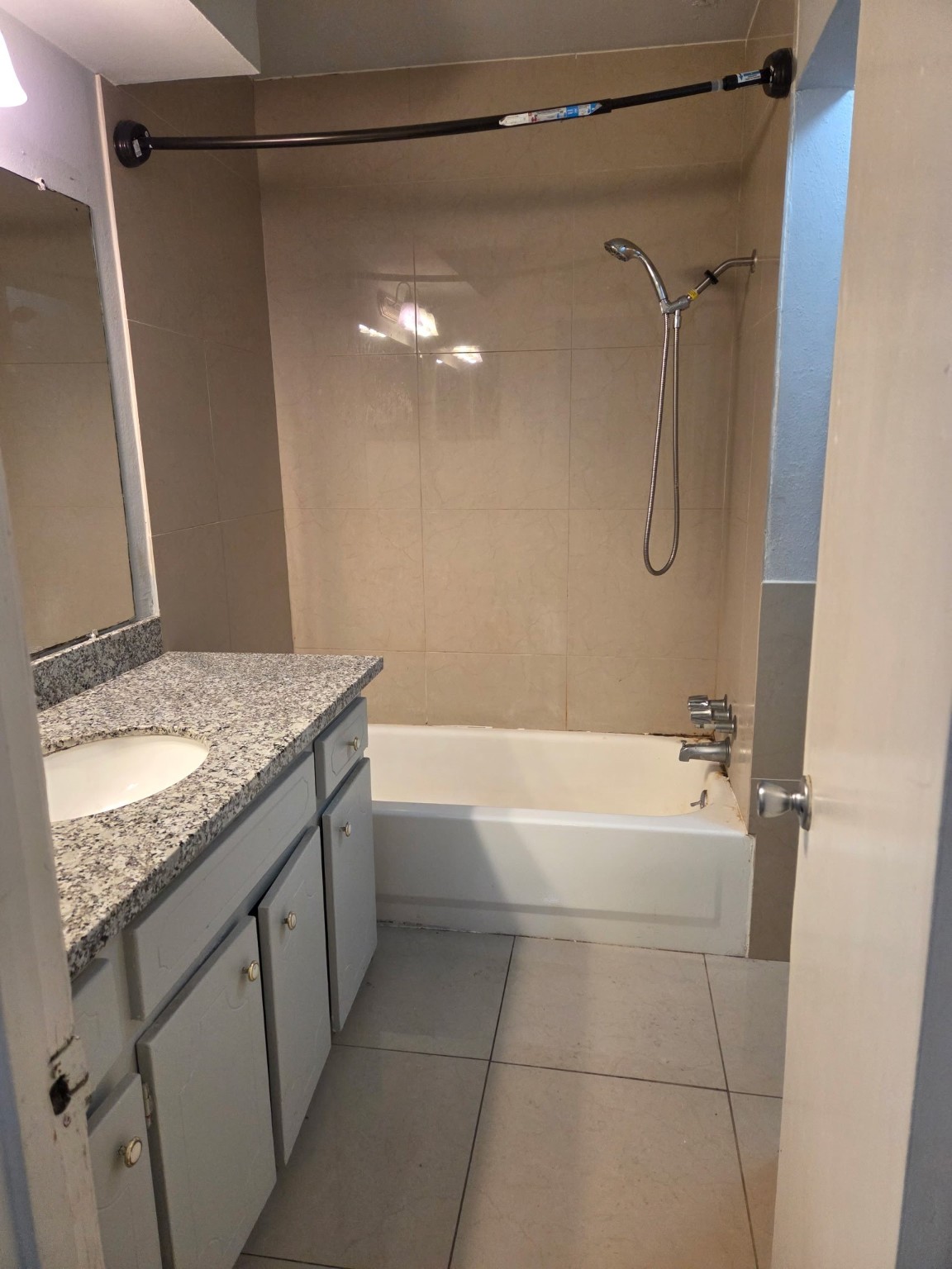 306 North Street, Unit 14 Houston, TX 77009 - Photo 6 of 17 a bathroom with a granite countertop shower sink and vanity