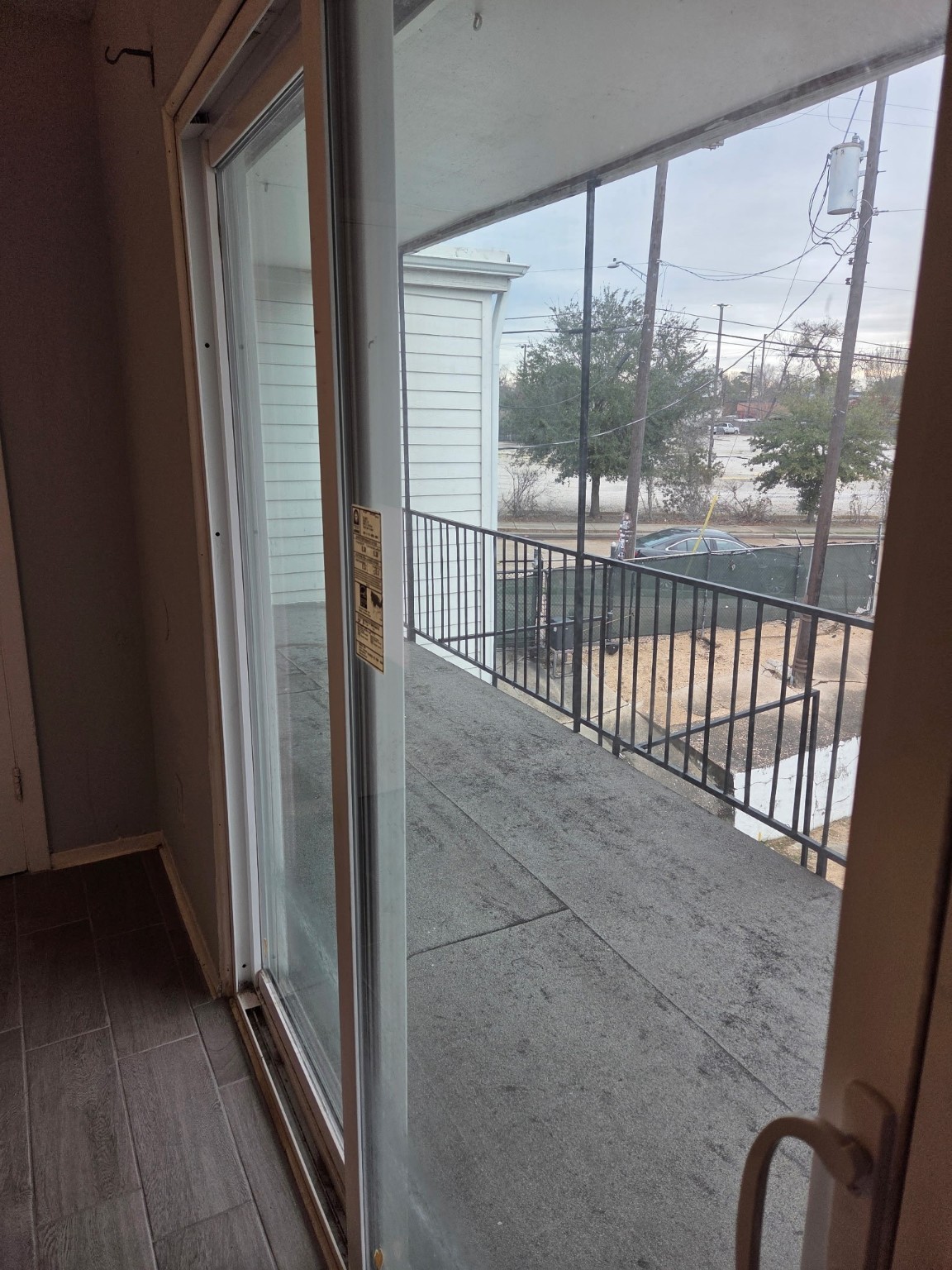 306 North Street, Unit 14 Houston, TX 77009 - Photo 8 of 17 a view of a balcony with wooden floor