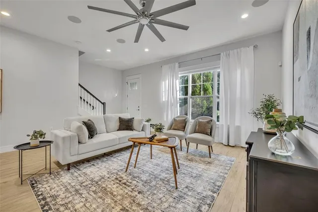 a living room with furniture and a large window