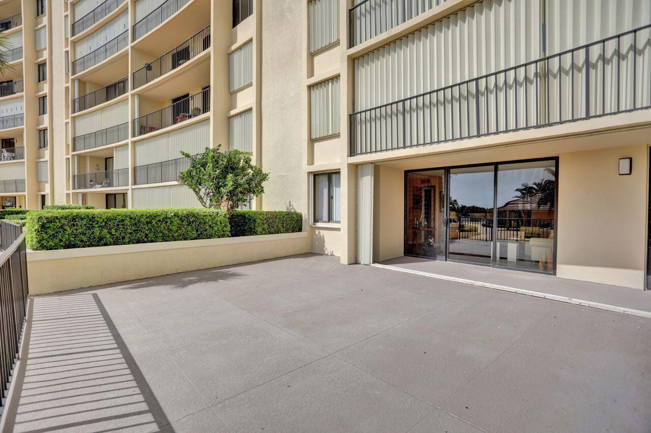 100 Ocean Trail Way, Unit 109 Jupiter, FL 33477 - Photo 12 of 27 a view of a building with a patio