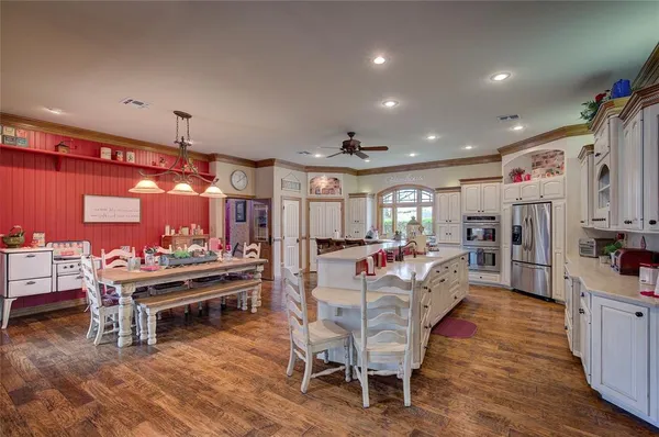 a view of a dining room with furniture and wooden floor