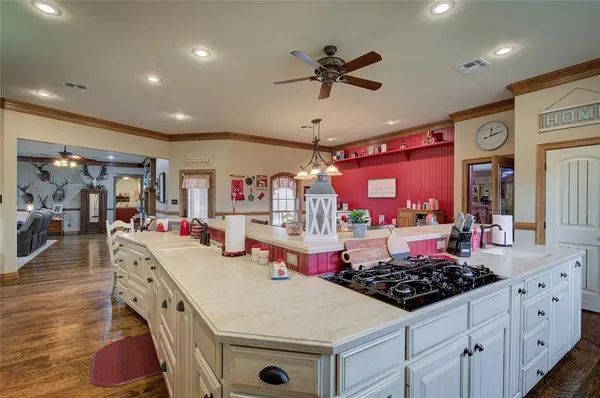 a kitchen with stainless steel appliances granite countertop a sink and cabinets