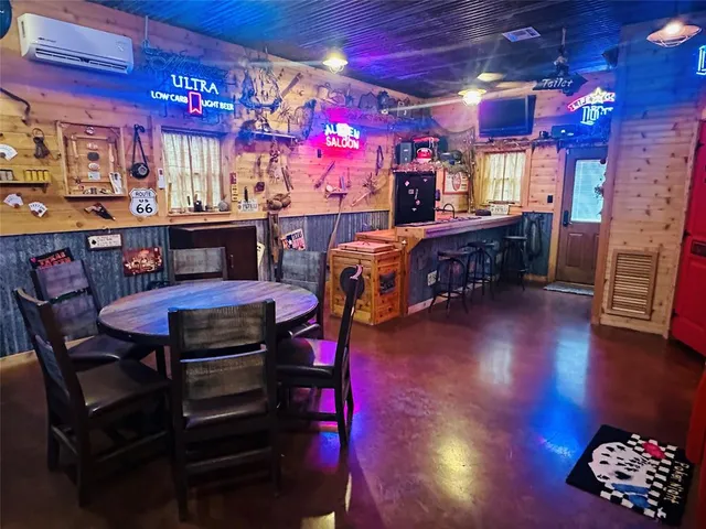 a view of a chairs and tables in a room