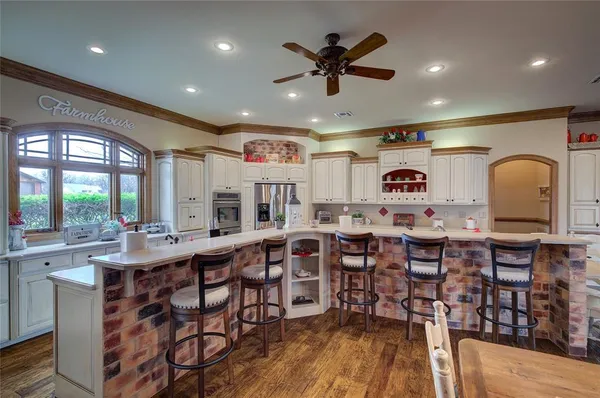a bathroom with a sink a toilet and shower curtain