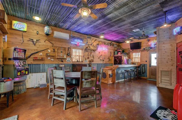 a view of dining room with furniture and wooden floor