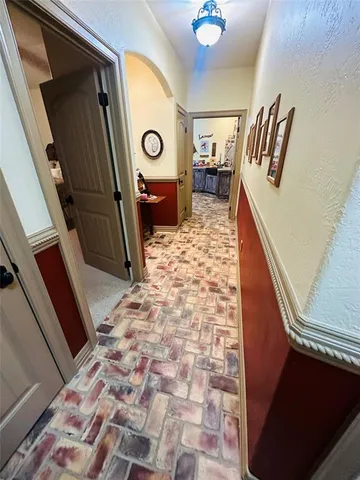a living room with a wooden floor and a table