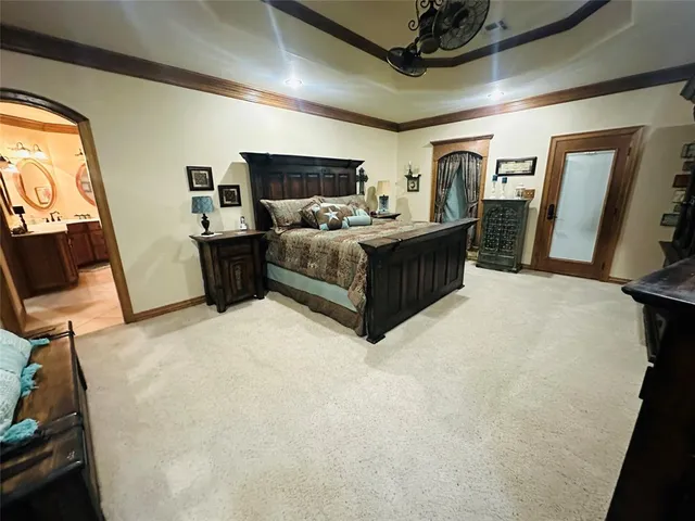 a bed room with a bed and a television