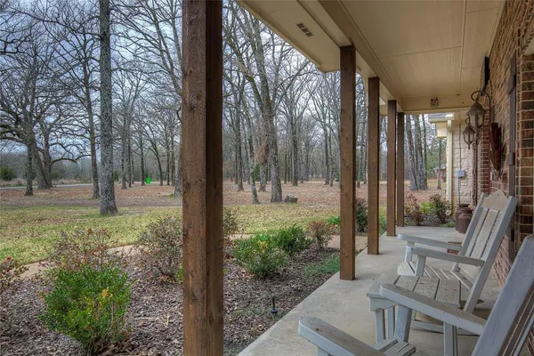 a front view of a house with a yard and porch