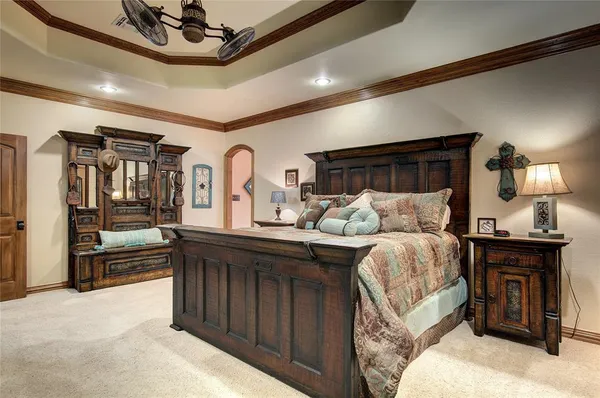 a bedroom with a bed and a tv on table