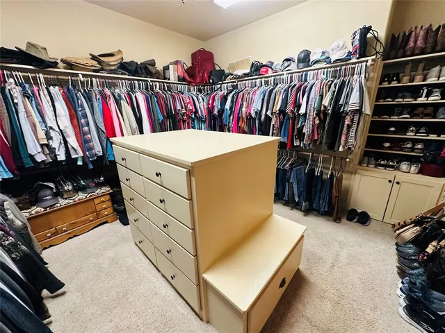 a bedroom with a bed and a tv on table