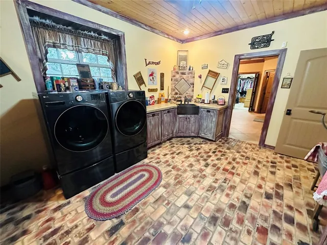 a view of a house with a yard and sitting area