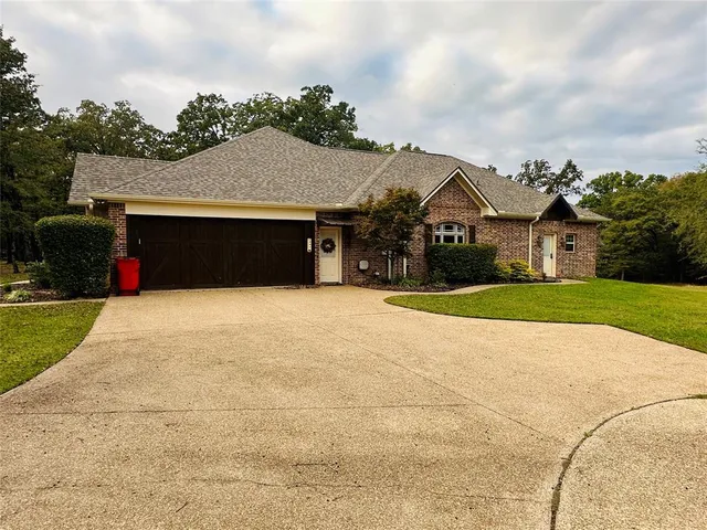 a house with swimming pool in front of it