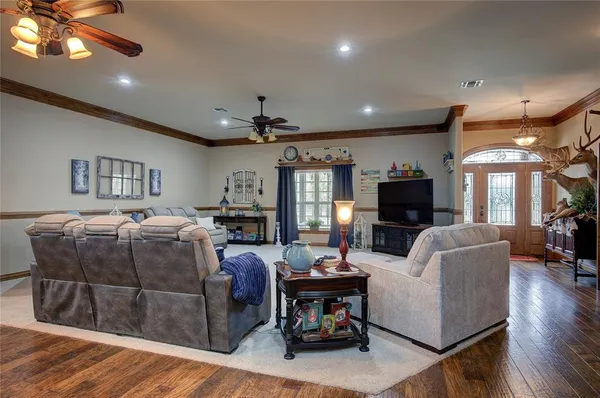 a bedroom with furniture and a book shelf