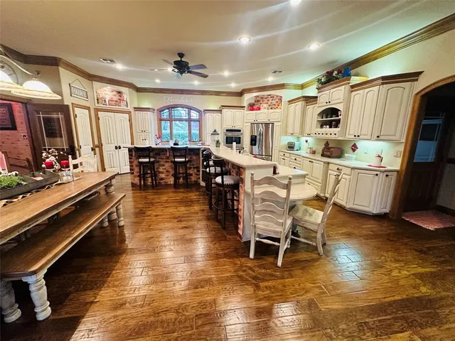 a dining room with furniture and chandelier
