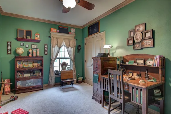a kitchen with stainless steel appliances a stove a sink a refrigerator cabinets and living room view