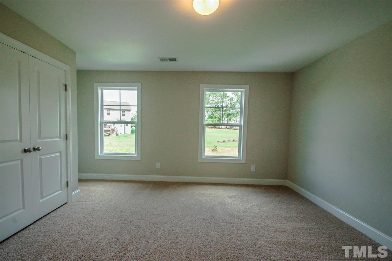1124 Silver Farm Road Raleigh, NC 27603 - Photo 19 of 25 an empty room with a window