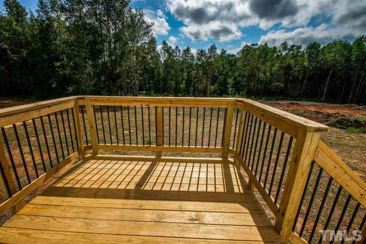 1124 Silver Farm Road Raleigh, NC 27603 - Photo 22 of 25 a view of balcony with wooden floor
