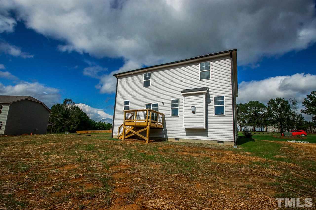 1124 Silver Farm Road Raleigh, NC 27603 - Photo 24 of 25 a view of a house with a yard