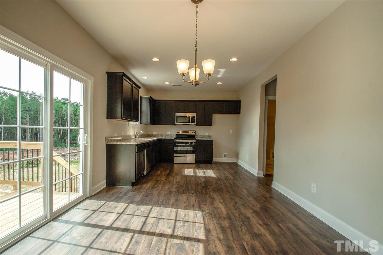 1124 Silver Farm Road Raleigh, NC 27603 - Photo 4 of 25 a view of a kitchen with a sink and microwave