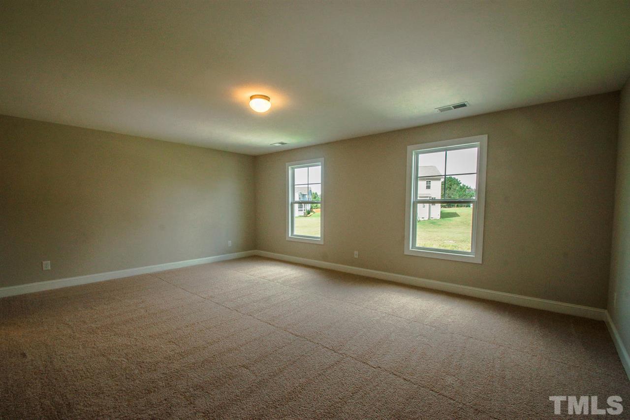 1124 Silver Farm Road Raleigh, NC 27603 - Photo 9 of 25 an empty room with a window