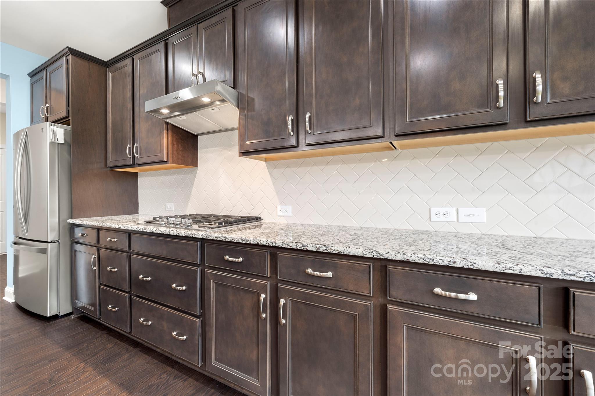 206 Houston Blair Road Matthews, NC 28104 - Photo 19 of 44 a kitchen with granite countertop stainless steel appliances a sink and cabinets