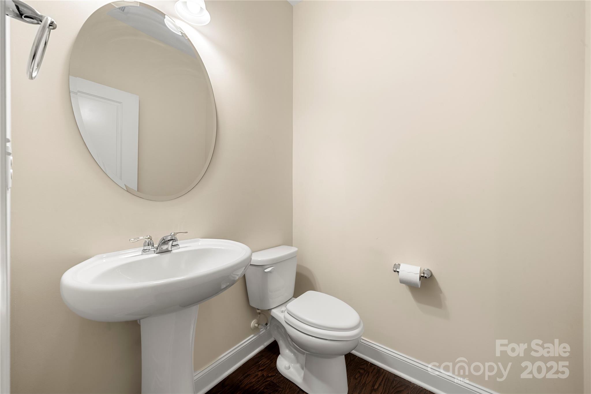 206 Houston Blair Road Matthews, NC 28104 - Photo 31 of 44 a bathroom with a sink a mirror and a toilet