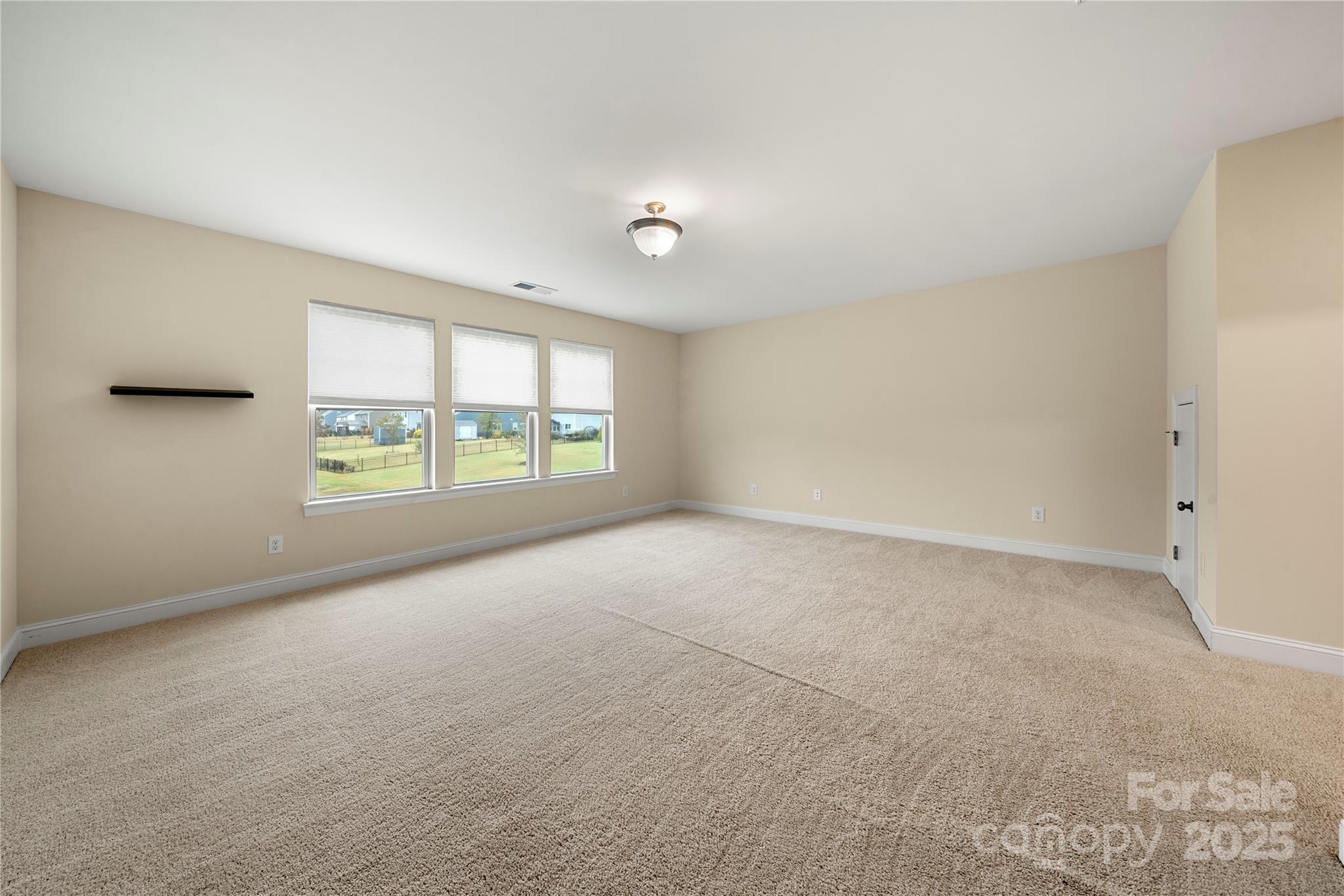 206 Houston Blair Road Matthews, NC 28104 - Photo 34 of 44 an empty room with windows