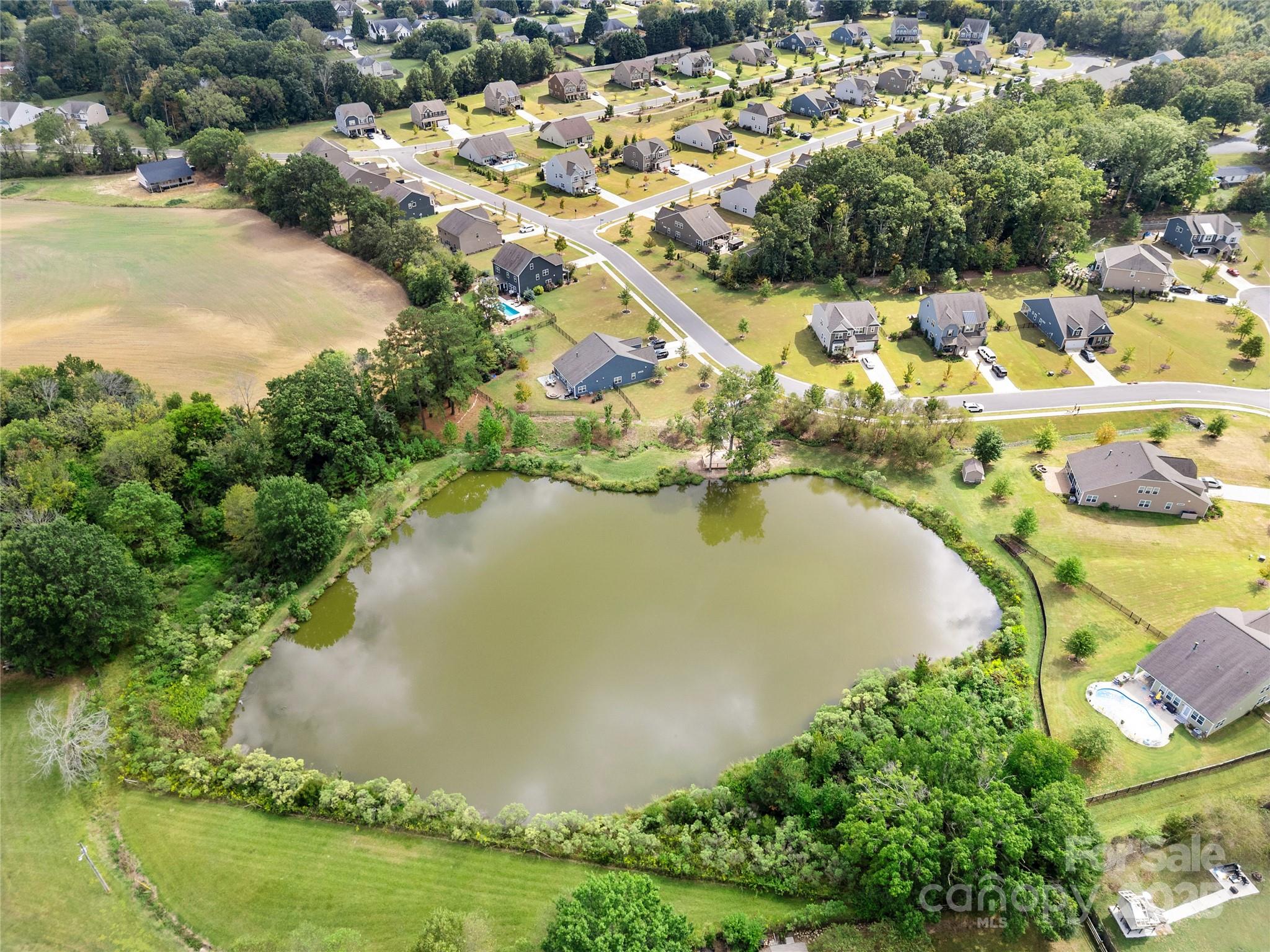 206 Houston Blair Road Matthews, NC 28104 - Photo 43 of 44 an aerial view of residential houses with outdoor space and swimming pool