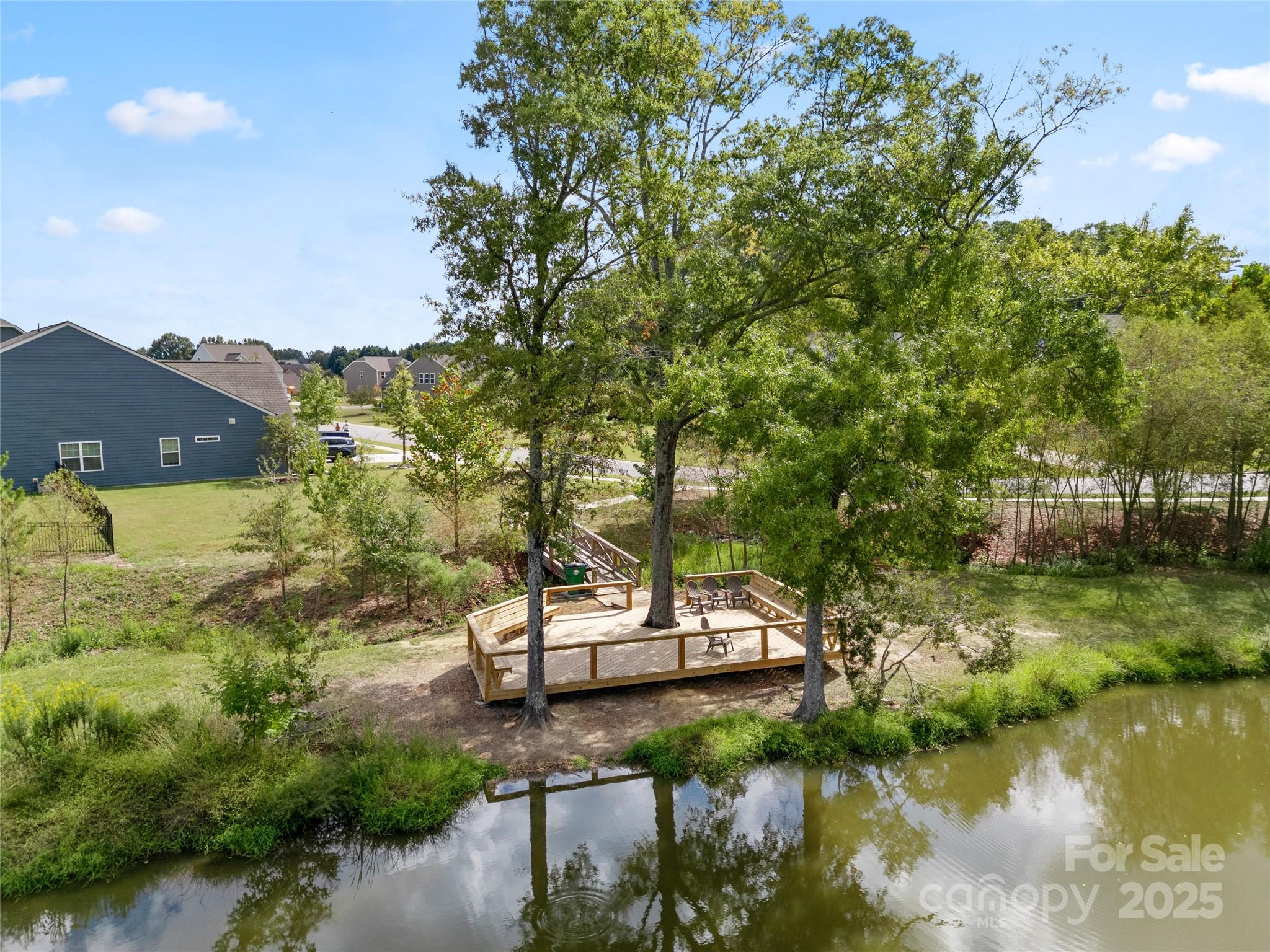 206 Houston Blair Road Matthews, NC 28104 - Photo 44 of 44 a view of a lake with houses