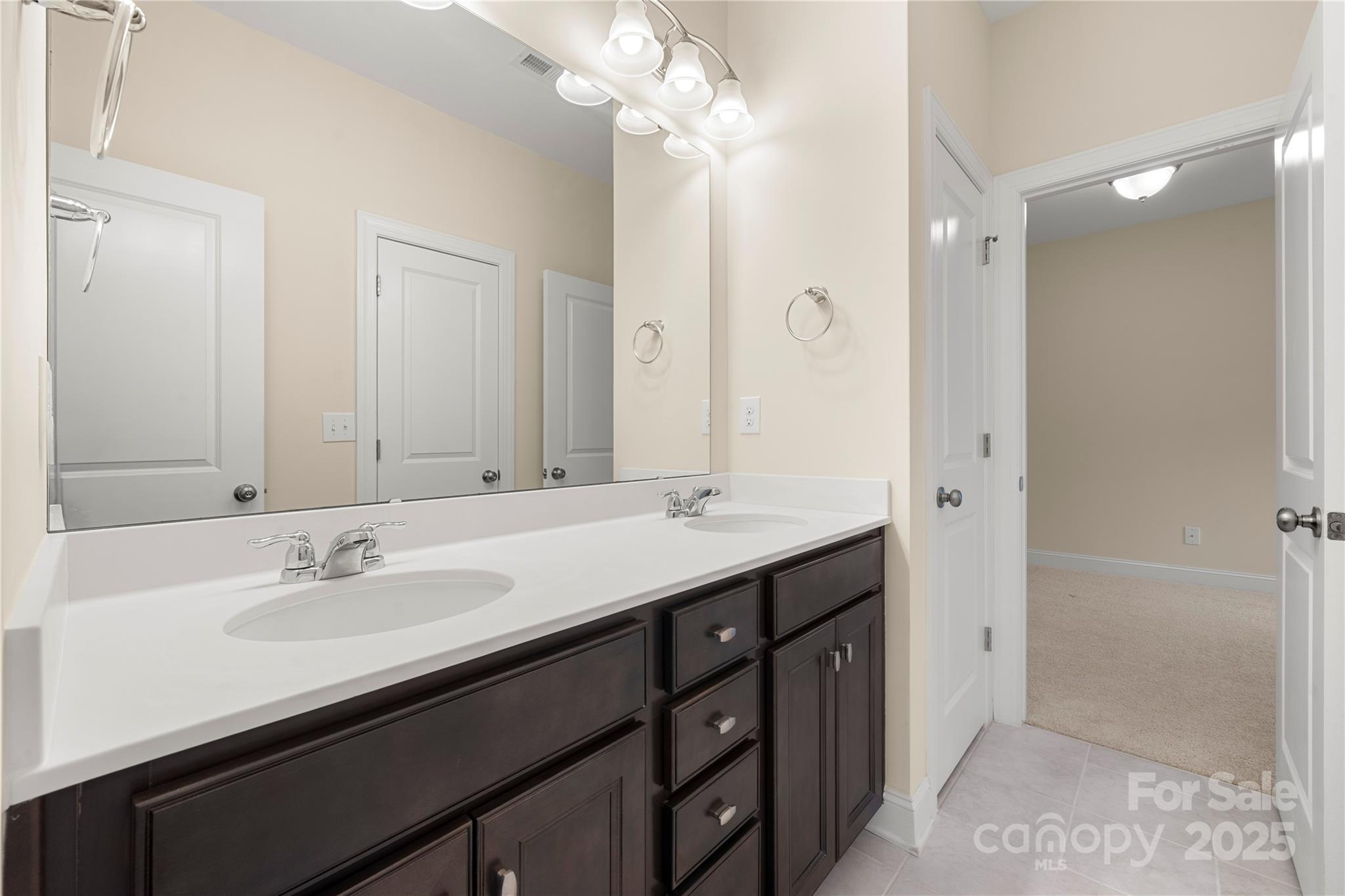 206 Houston Blair Road Matthews, NC 28104 - Photo 8 of 44 a bathroom with a sink double vanity and a mirror