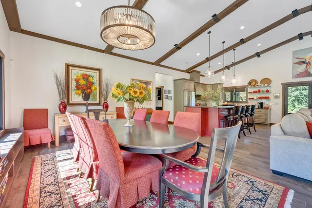a kitchen with stainless steel appliances granite countertop a sink and wooden cabinets