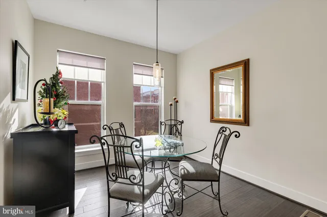 a view of a dining room with furniture and window