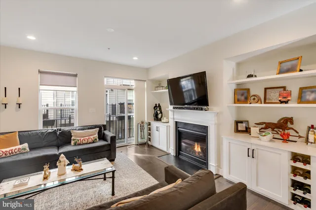 a living room with furniture fireplace and flat screen tv
