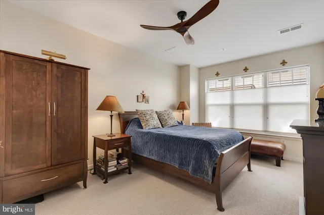 a bed room with a bed and a window