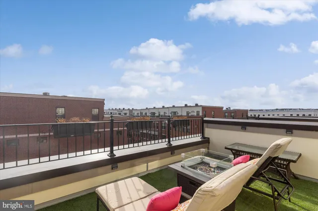 a view of a terrace with seating area