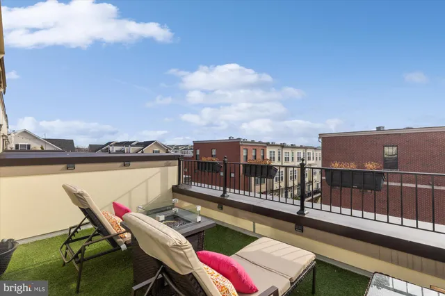 a front view of a building with a lot of windows